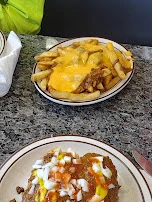 2 Coney Specials with Everything on Them and an Order of Chili Cheese Fries
